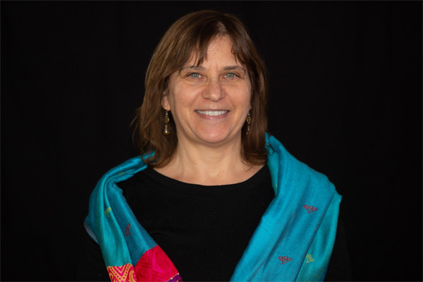 Headshot of Amy Gottlieb, Just Migration Director for US Programs with the American Friends Service Committee